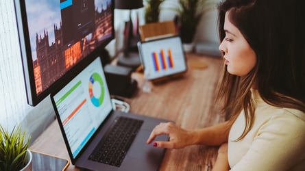 female working on laptop in office